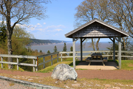 Unspoiled landscape with picnic table overlooking the Bay of Fundy on the Fundy Trail Parkway in New Brunswick, Canadaの写真素材