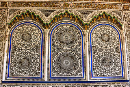 Beautiful pattern work on the wall along a street in the Souk of Fez, Morocco, Africaの写真素材