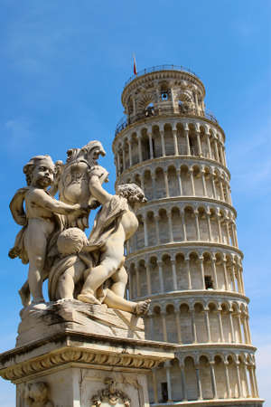 Statue in front of the Leaning Tower of Pisa in Italy, Europeの写真素材