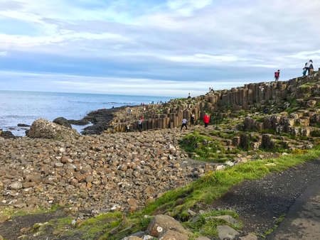 Giants Causeway, Northern Ireland - August 21, 2017:  Beautiful scenery with basalt columns sticking out of the ground at Giants Causeway in Northern Ireland in the county of Antrim in the United Kingdom, Europeのeditorial素材