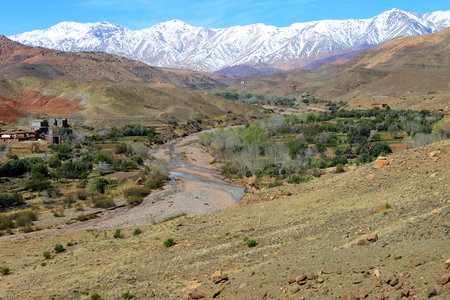 Middle Atlas Mountains in Morocco, Africa, showing contrasts in terrain, with snow and greeneryの写真素材