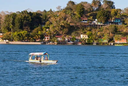 Flores, Guatemala - 2017-03-03: Boat on Lake Peten Itza in late afternoon, Guatemala, Central Americaのeditorial素材