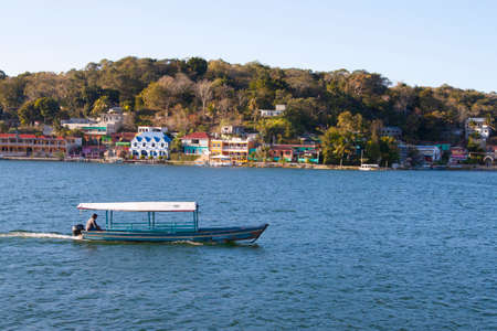 Flores, Guatemala - 2017-03-03: Boat on Lake Peten Itza in late afternoon, Guatemala, Central Americaのeditorial素材