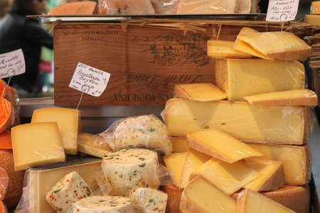 Munich, Germany - 10/15/2016: Cheese display in cheese shop at Victuals Market in Munich Germans also known as Viktualienmarkt in Germanのeditorial素材