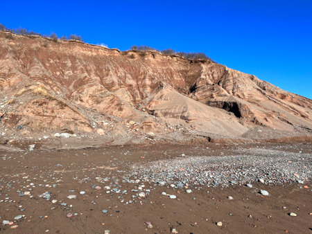 Beach along the Bay of Fundy in New Brunswick shows erosion on the sandy cliffs, the cause of storms and wind coming from the oceanの写真素材
