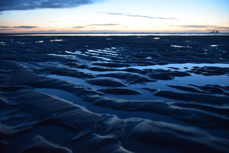 Photo of sunset over the sea coast, filmed from the coast