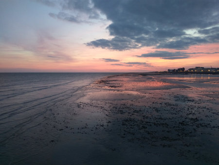 Photo of sunset over the sea coast, filmed from the Pier