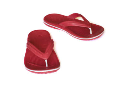 Pair of red flip-flop isolated on a white backgroundの写真素材