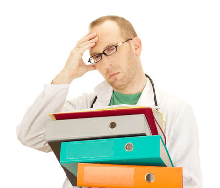 Medical doctor with a lot of workの写真素材