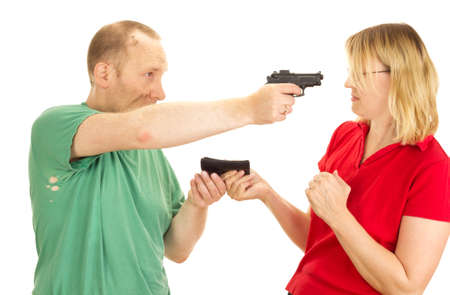 A man hold a woman at gunpointの写真素材