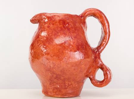 A clay jug on a tableの写真素材