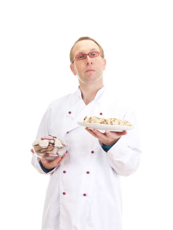 Baker with gingerbreads and stollenの写真素材
