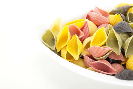 Uncooked and colorful italian noodlesの写真素材