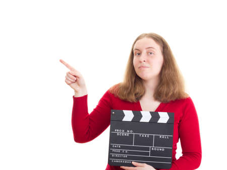 Woman with clapperboard pointing at somethingの写真素材