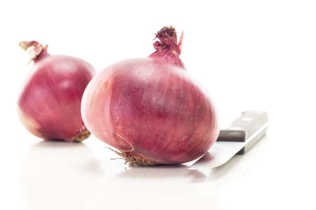 Cutting red onions for delicious saladの写真素材