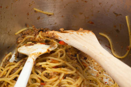 Close up of spaghetti bolognese in the cooking potの写真素材