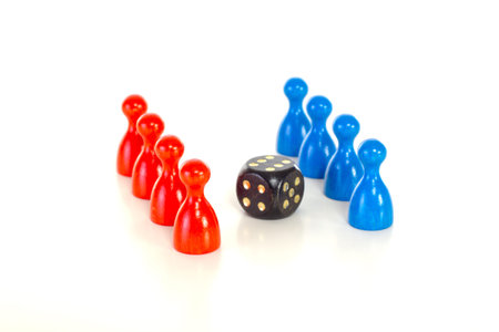 Colorful meeples with black die