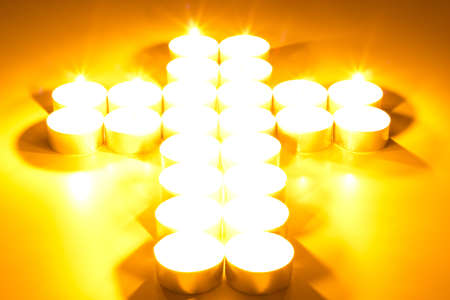 Cross of lighted candlesの写真素材