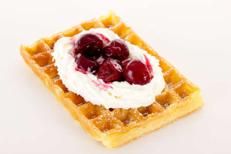 Waffle with cream and cherriesの写真素材