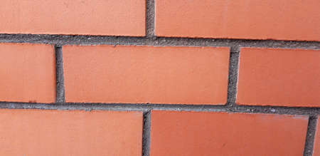 Wall of red smooth brick for background.の写真素材