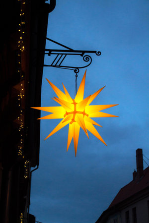 Christmas star at dusk on the background of the evening skyの写真素材