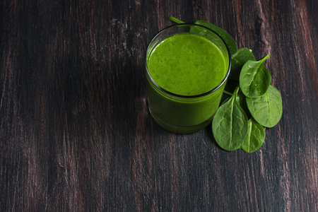spinach smoothie on wooden board
