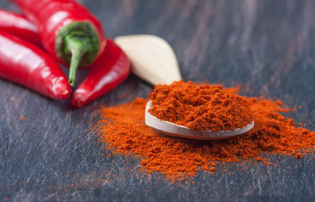 milled red chili pepper  on a wooden table