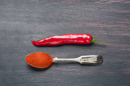 red chilly peppers  on a wooden table,  selective focusの写真素材