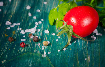 fresh cherry tomatoes   on old wooden background, selective focusの写真素材