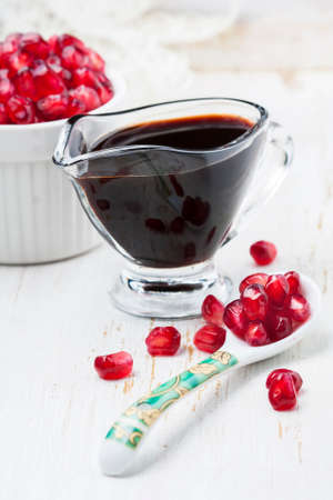 pomegranate sauce, on white background. Selective focusの写真素材