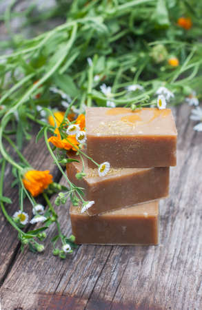 Natural handmade soap with calendula on a light background. Selective focusの写真素材