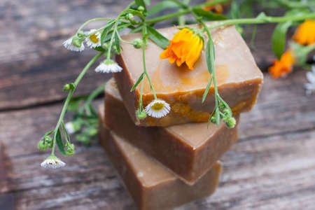 Natural handmade soap with calendula on a light background. Selective focusの写真素材