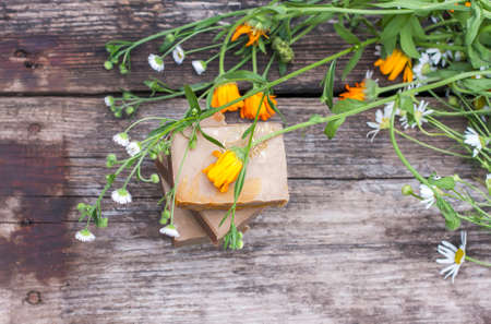 Natural handmade soap with calendula on a light background. Selective focusの写真素材