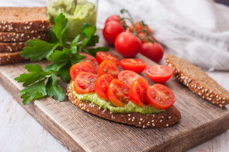 Bruschetta with cherry tomato and herb pesto. Selelective focusの写真素材