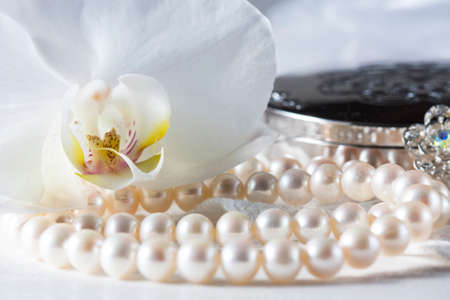Orchid flower with a pearl necklace. Selective focus, macroの写真素材