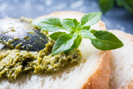 bread with pesto, basil  on a wooden background. Selelective focusの写真素材
