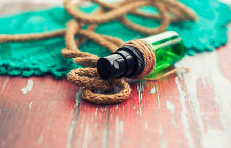 green bottle for cosmetic, blur the background. tone processingの写真素材