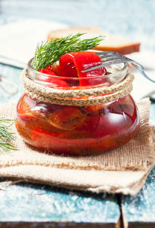 Red pepper marinated close-up in the bank. Selective focus.の写真素材