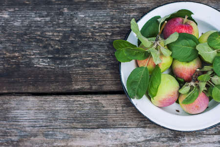 Organic apples on wooden table, selective focusの写真素材