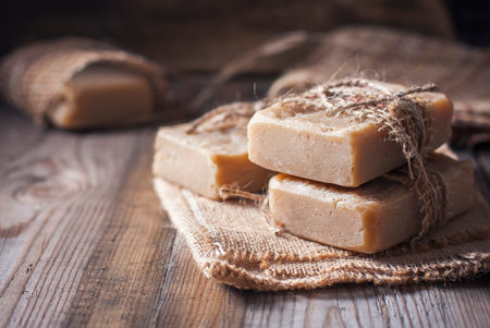 Handmade soap on a wooden background. Selective focus