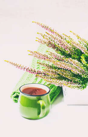 Bouquet of heather, tea mug and knitted scarf, selective focusの写真素材