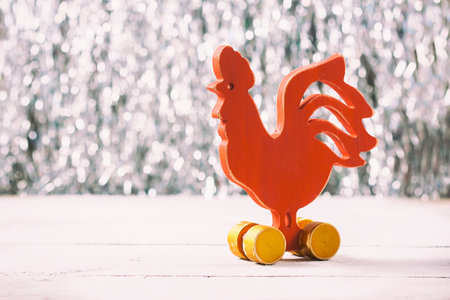 Wooden red rooster. New Year of rooster. Selective focus.の写真素材
