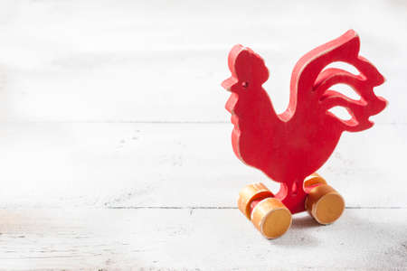 Wooden red rooster. New Year of rooster. Selective focus.の写真素材