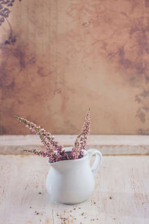Heather in a white vase. Selective focusの写真素材