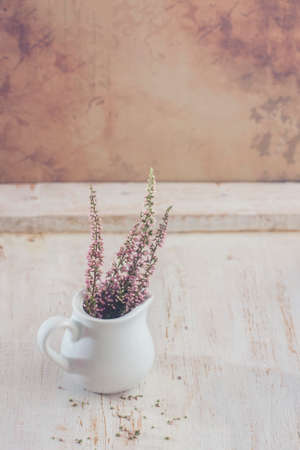Heather in a white vase. Selective focusの写真素材