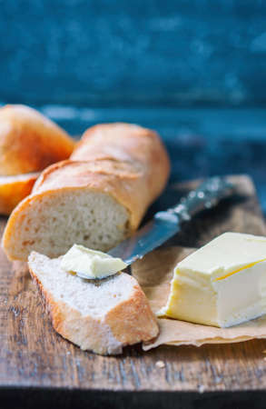 Fresh baguette on wooden table, close up. Selective focusの写真素材