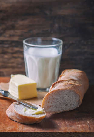 Fresh baguette on wooden table, close up. Selective focusの写真素材