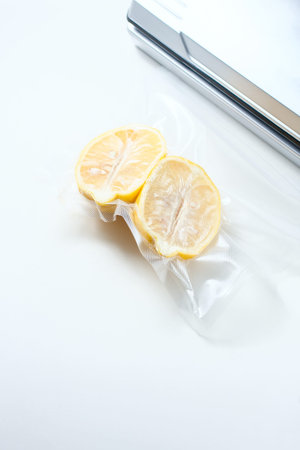 lemon in a vacuum package. Sous-vide, new technology cuisine. Sous-vide. Selective focusの写真素材