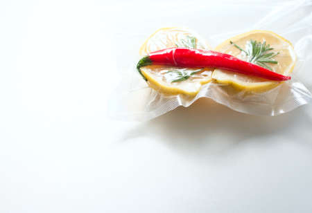 lemon in a vacuum package. Sous-vide, new technology cuisine. Sous-vide. Selective focusの写真素材