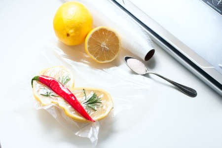 lemon in a vacuum package. Sous-vide, new technology cuisine. Sous-vide. Selective focusの写真素材